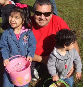 Daddy and Kids hunt easter eggs