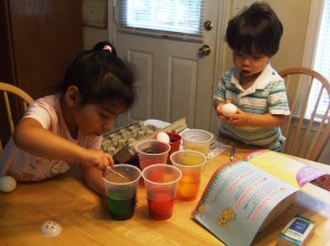 Kids dyeing Easter eggs
